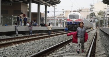 A migrant boy walks on a rail track at the Larissis Station in Athens, Greece, April 5, 2019. (AP Photo)