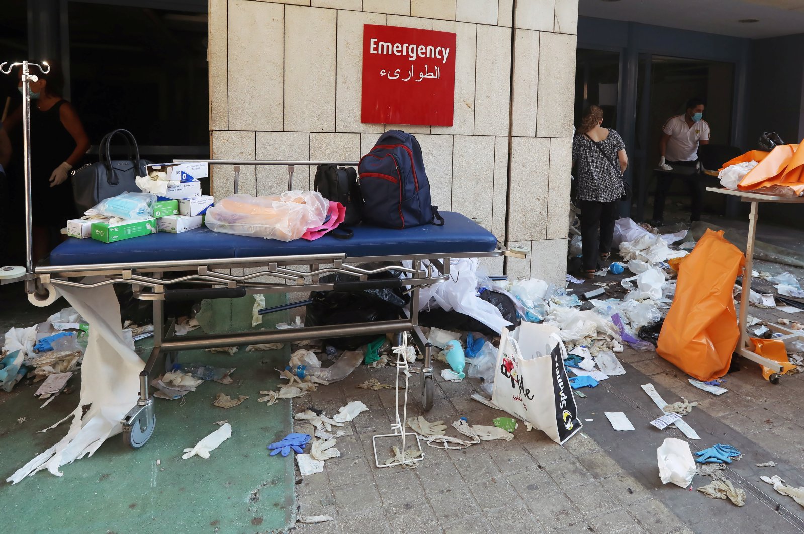Protective gloves are scattered on the ground at a damaged hospital following the blast, Beirut, Aug. 5, 2020. (REUTERS Photo)