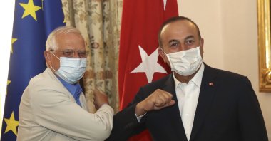 Foreign Minister Mevlüt Çavuşoğlu (R) and Josep Borrell Fontelles, high representative and vice-president of the European Commission, greet each other by touching elbows before a meeting in Valletta, Malta, Aug. 6, 2020. (AP Photo)