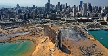 An aerial view shows the massive damage done to Beirut port's grain silos (C) and the area around it, one day after a mega-blast tore through the harbor in the heart of the Lebanese capital with the force of an earthquake, Beirut, Lebanon, Aug. 5, 2020. (AFP Photo)