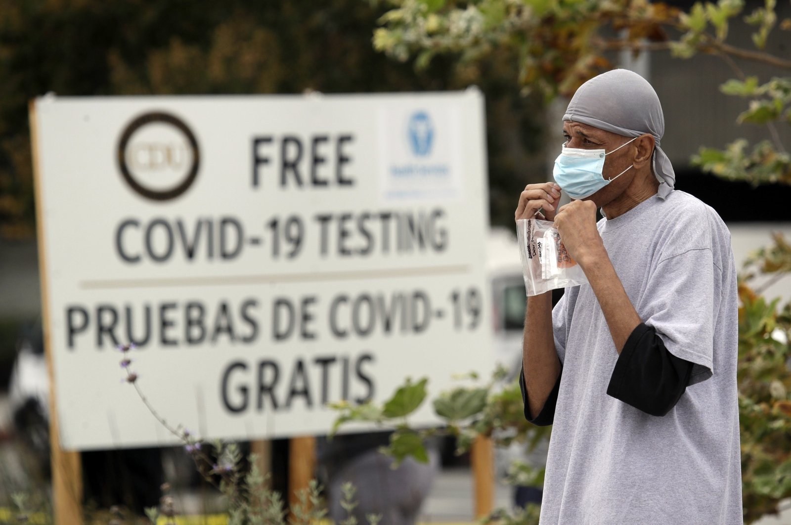 A man takes a coronavirus test at a mobile site at the Charles Drew University of Medicine and Science, Los Angeles, California, U.S., July 22, 2020. (AP Photo)