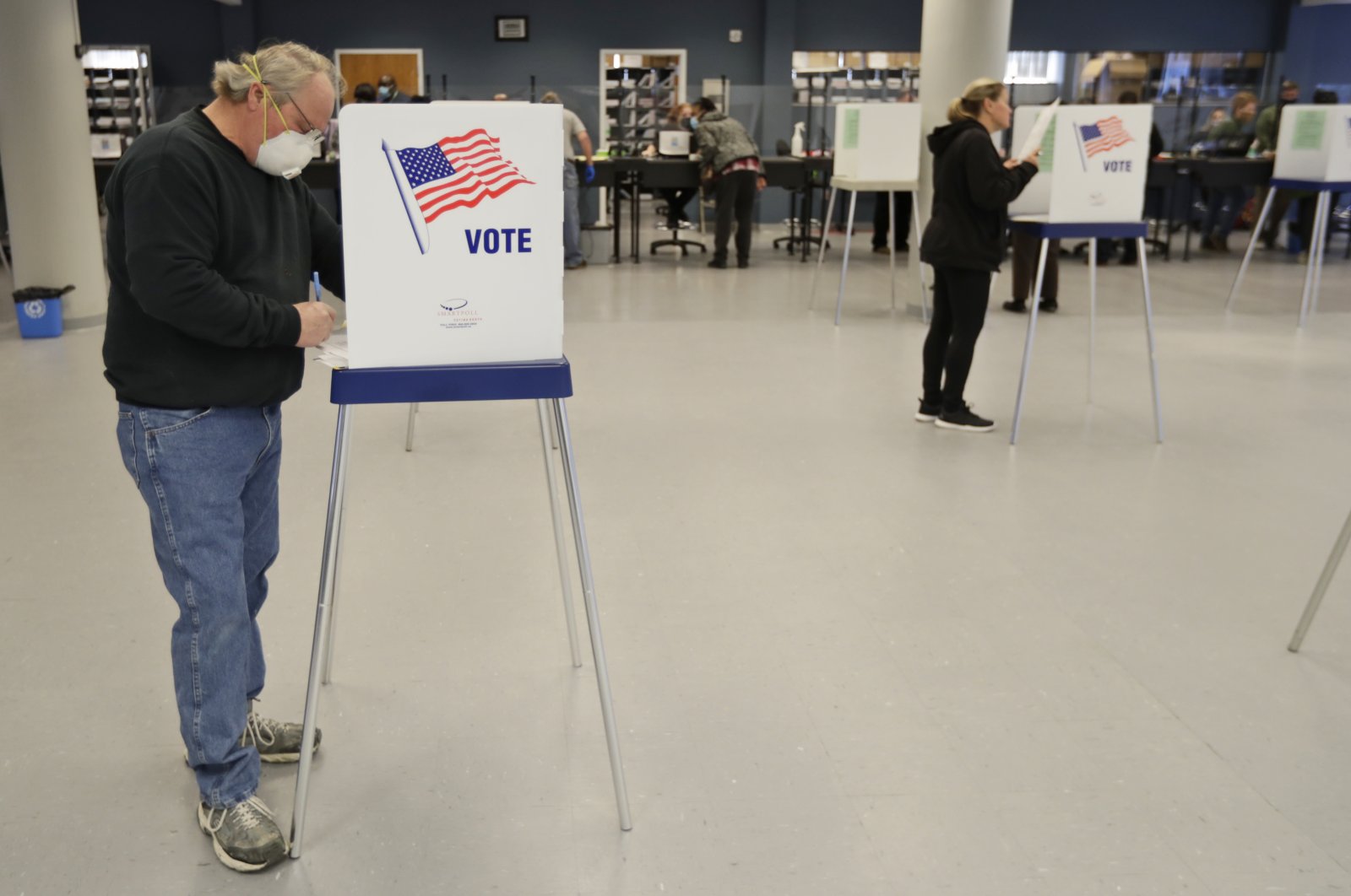People are voting while social distancing at the Cuyahoga County Board of Elections, Cleveland, Ohio, U.S., April 28, 2020. (AP Photo)