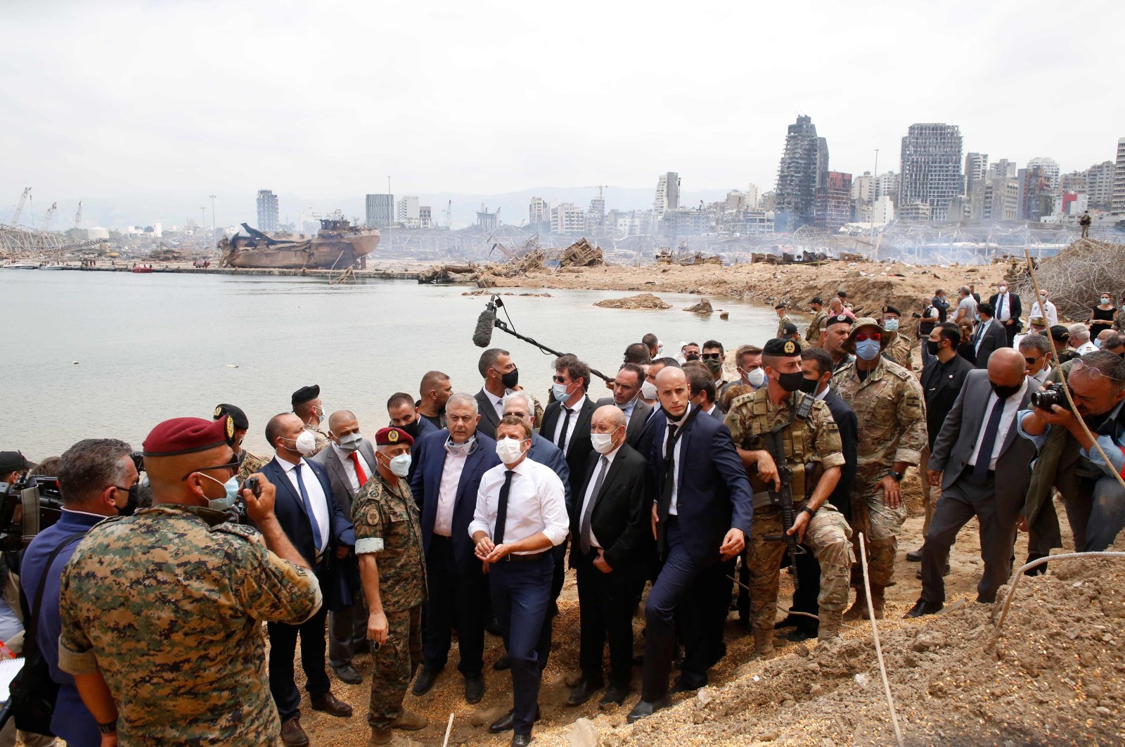 French President Emmanuel Macron (C) visits the devastated site of the explosion at the port of Beirut, Aug. 6, 2020. (AFP Photo)