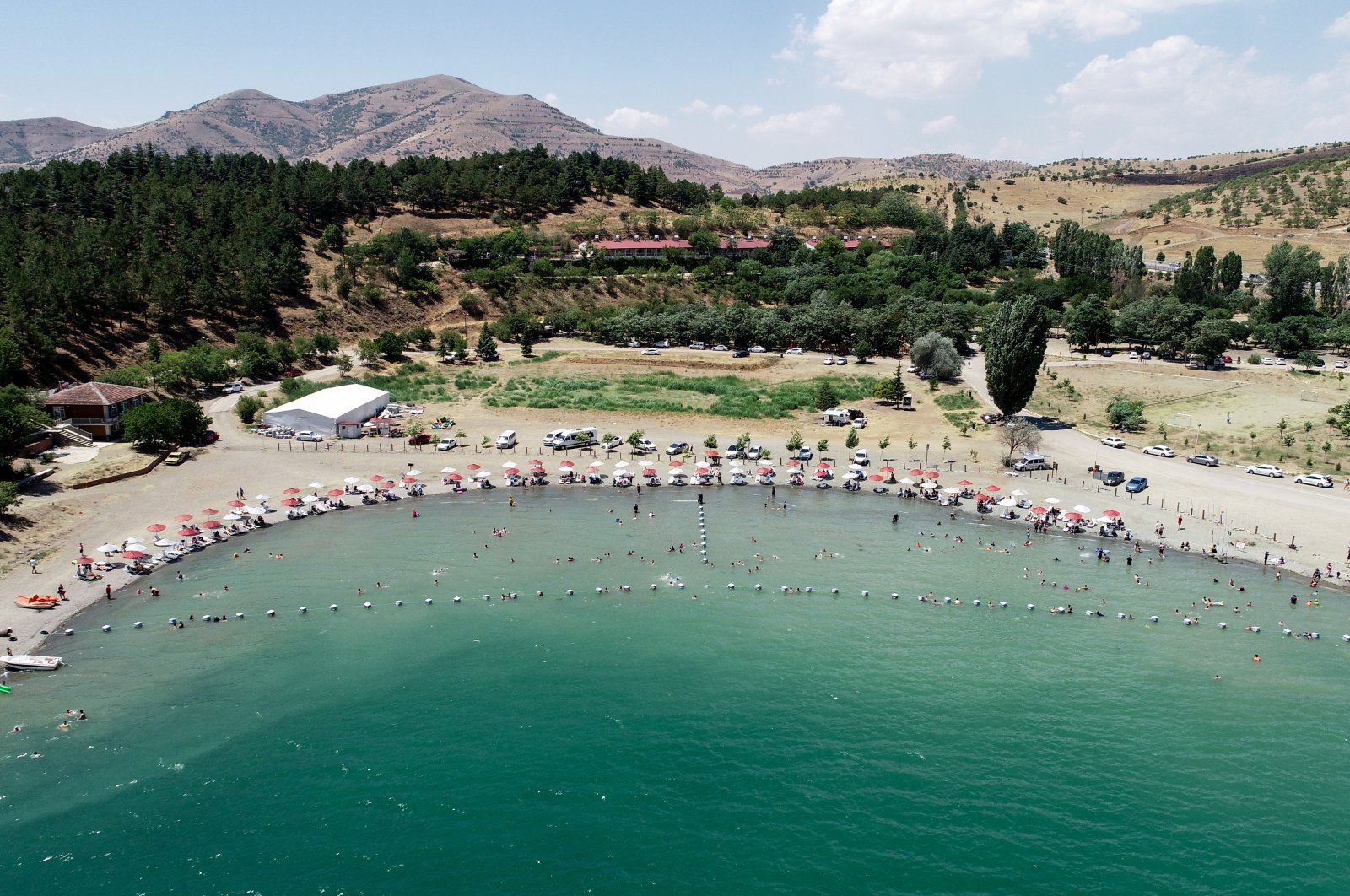 Vacationers on sunbeds are seen at Lake Hazar in Elazığ province, eastern Turkey, Aug. 7, 2020. (AA Photo)