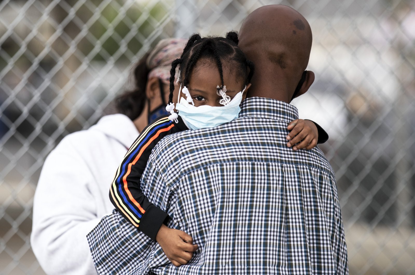Father and daughter wearing face masks wait to get a COVID-19 test at a mobile COVID-19 clinic, Los Angeles, California, U.S., July 17, 2020. (EPA Photo)