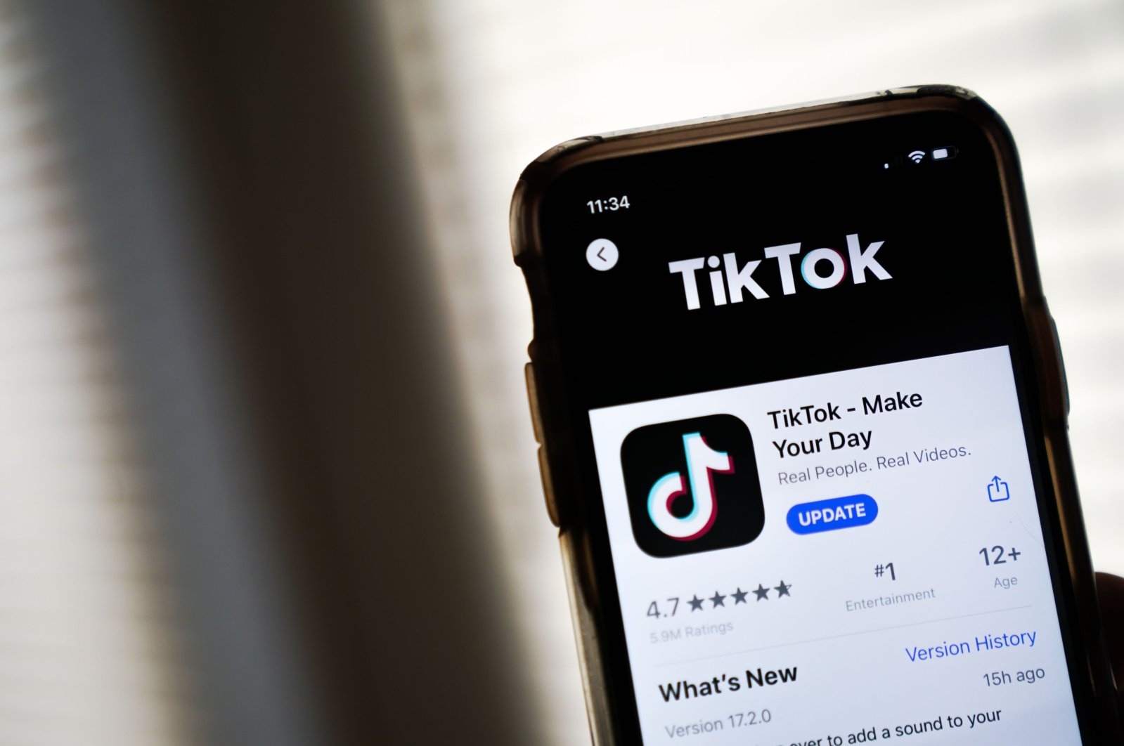 In this photo illustration, the download page for the TikTok app is displayed on an Apple iPhone, Washington, D.C., U.S., Aug. 7, 2020. (AFP Photo)