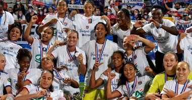 Lyon's players pose with the trophy at the end of the French Cup final in Auxerre, France, Aug. 9, 2020. (AFP Photo)