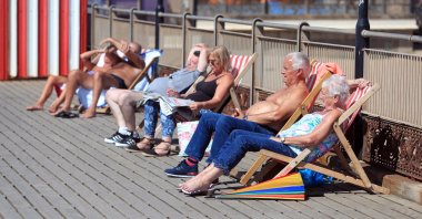 People sunbathe in Skegness, a seaside town in Lincolnshire in England on Aug. 7, 2020. (PA via Reuters)
 