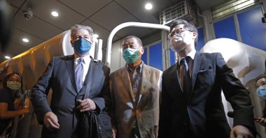 Hong Kong media tycoon and newspaper founder Jimmy Lai (C) walks out from a police station after being bailed out in Hong Kong, Aug. 12, 2020. (AP Photo)