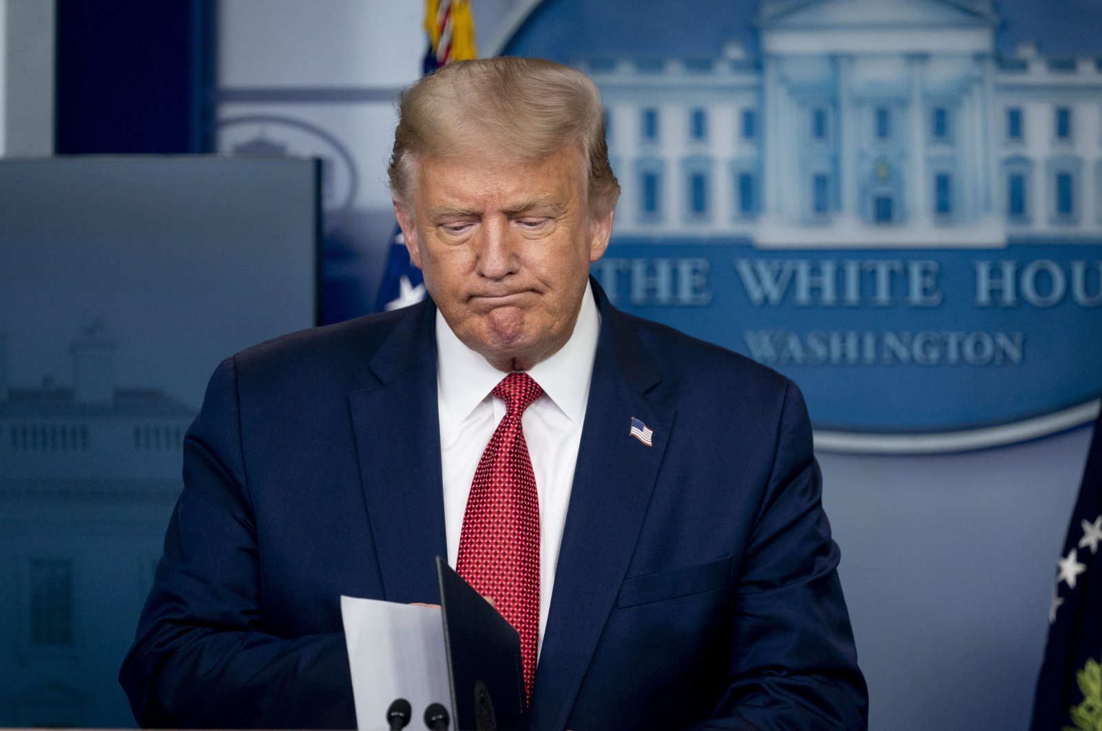 U.S. President Donald Trump returns to a news conference in the James Brady Press Briefing Room after he briefly left because of a security incident outside the fence of the White House in Washington, D.C., U.S., Aug. 10, 2020. (AP Photo)