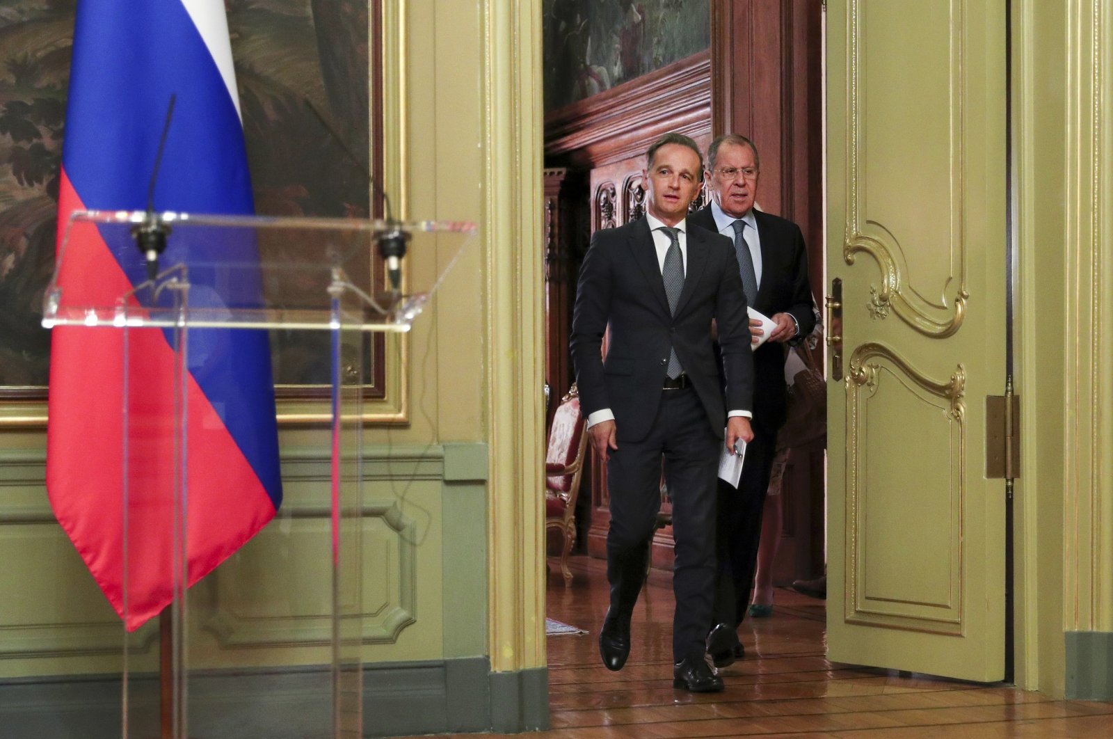 Russian Foreign Minister Sergey Lavrov (R), and German Foreign Minister Heiko Maas, enter a hall to attend their joint news conference following talks in Moscow, Russia, Aug. 11, 2020. (Russian Foreign Ministry Press Service via AP)