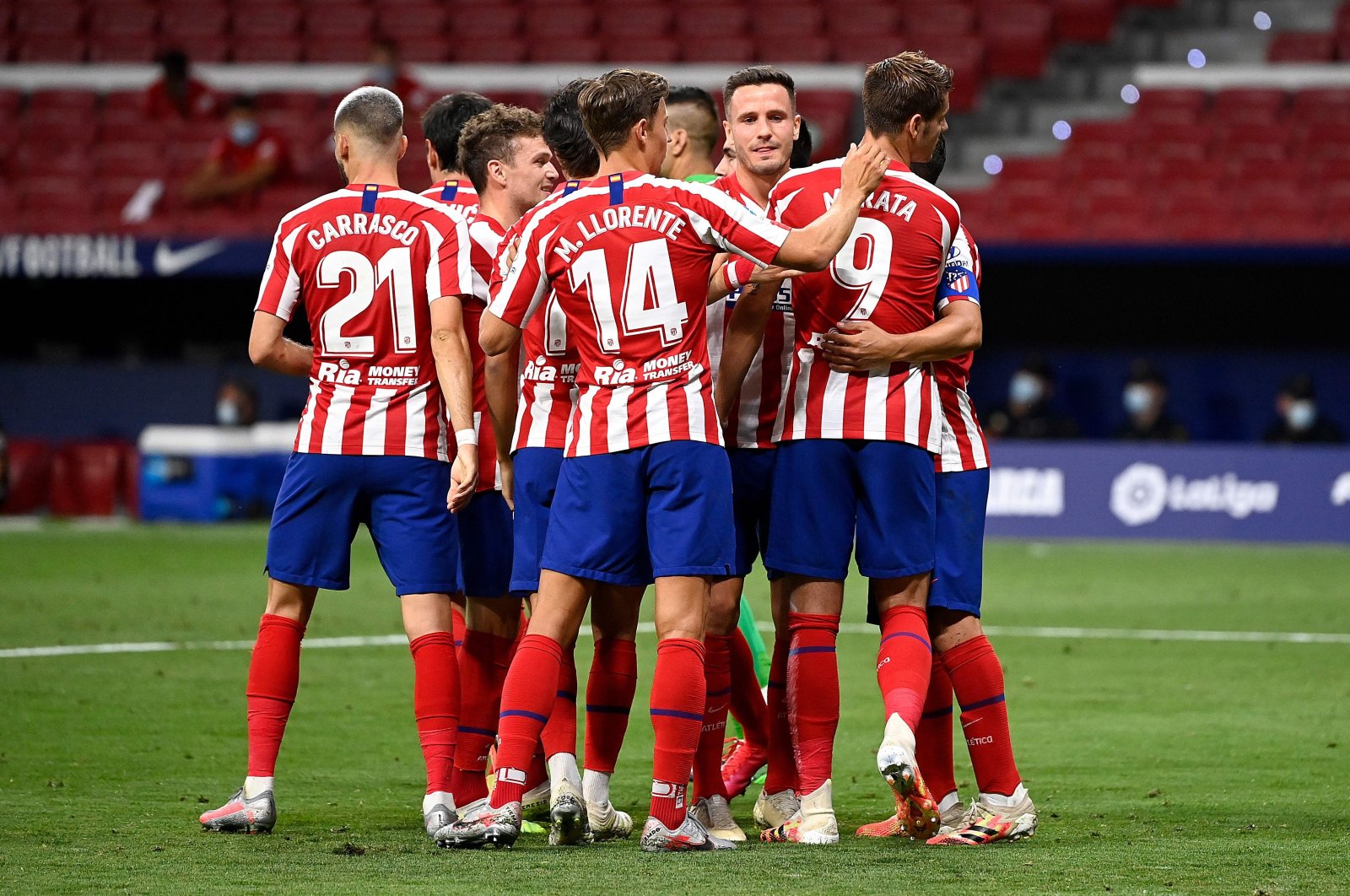 Atletico Madrid's players celebrate during a Spanish La Liga football match against Mallorca, in Madrid, Spain, July 3, 2020. (AFP Photo)