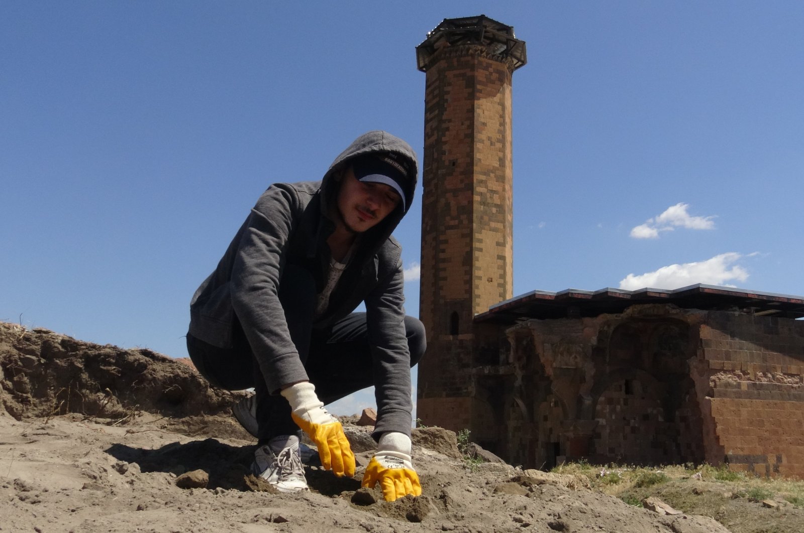 A young man is seen at the excavation site at Ebu'l Manuçehr Mosque, Kars, eastern Turkey.
