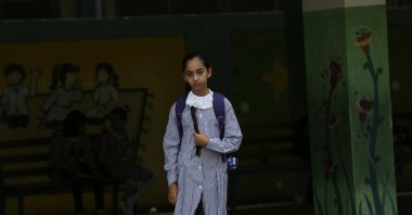A student walks to class on the first day of the new school year at the United Nations-run elementary school at Shati refugee camp, Gaza City, Palestine, Aug. 8, 2020. (AP Photo)