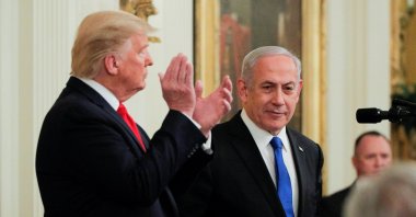 U.S. President Donald Trump applauds Israel's Prime Minister Benjamin Netanyahu as they appear together at a joint news conference to discuss a new Middle East peace plan proposal in the East Room of the White House in Washington, Jan. 28, 2020. (REUTERS Photo)