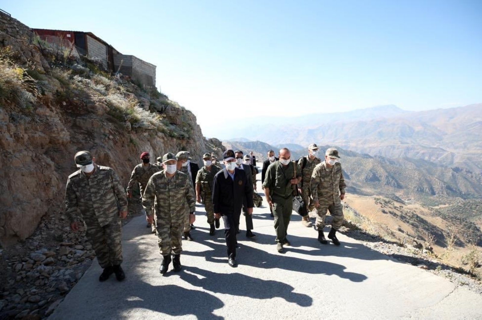 Defense Minister Hulusi Akar inspects troops at the Iraqi border in Turkey's southeastern Şırnak province, Aug. 9, 2020. (DHA Photo)