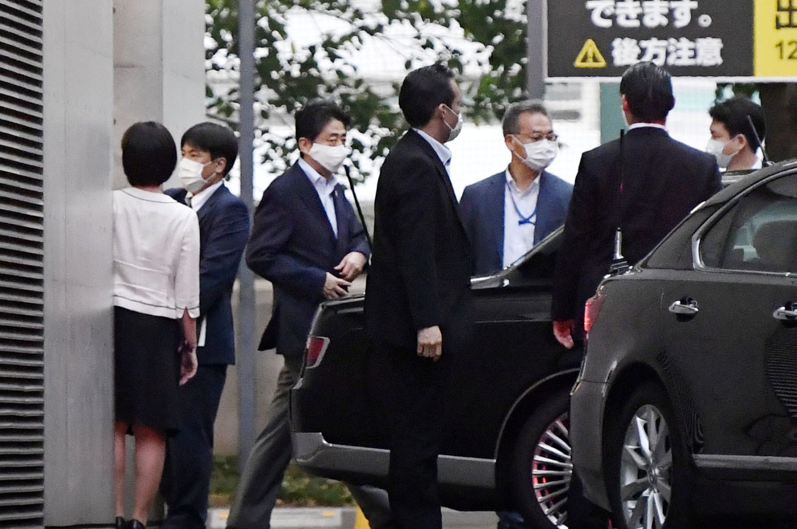 Japanese Prime Minister Shinzo Abe gets into a car as he leaves from Keio University Hospital in Tokyo, Japan, in this photo taken by Kyodo, August 17, 2020. (Kyodo Photo via Reuters) 