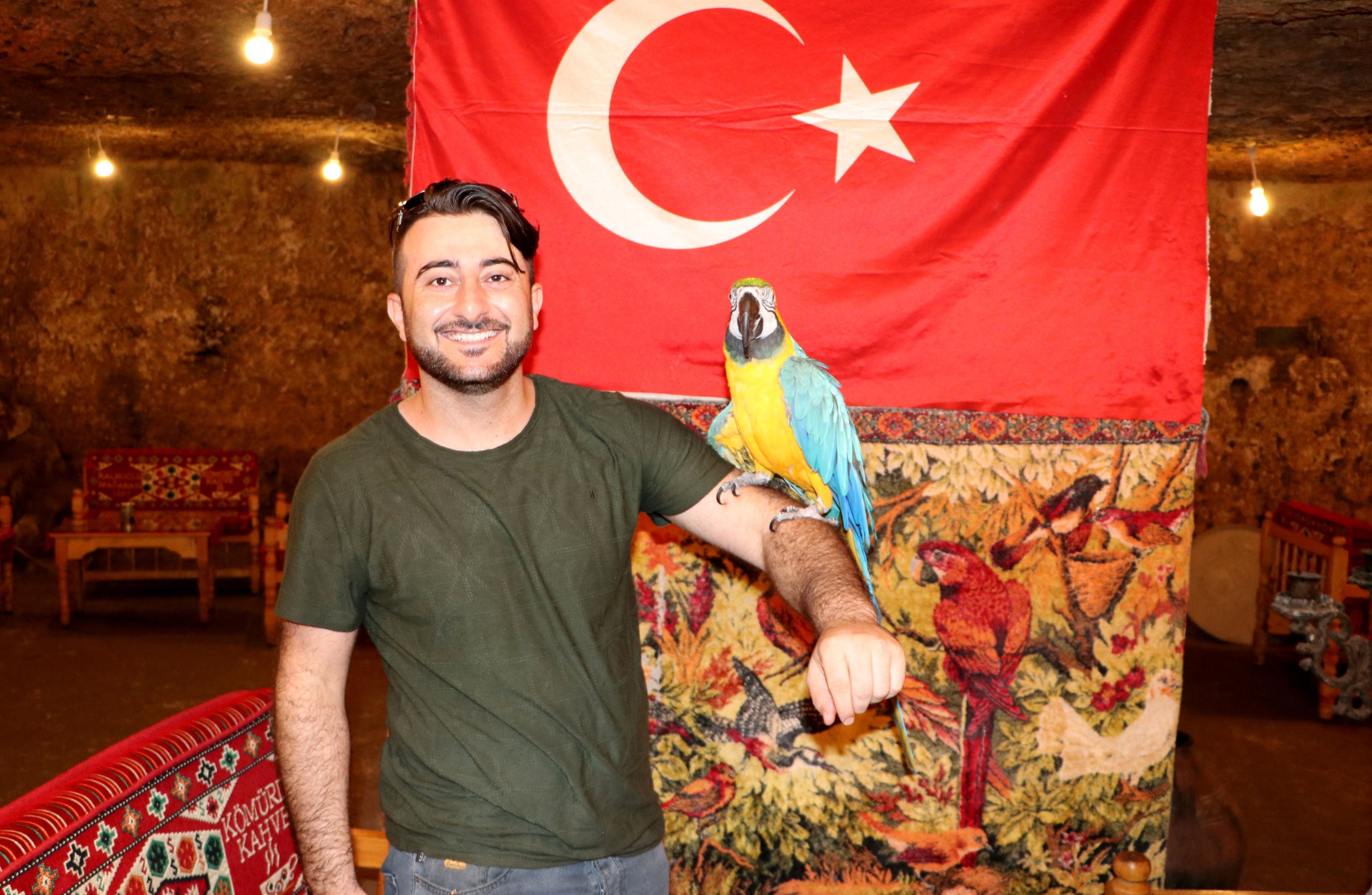 Cabbar poses with a local tourist for a souvenir photo at the Kaleoğlu cave on Aug. 16, 2020. (AA Photo)