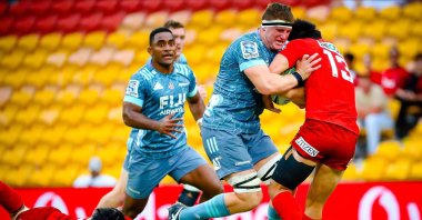 Crusaders' Tom Sanders is tackled by Sunwolves' Shogo Nakano (L) and Keisuke Moriya (R) during the Super Rugby match between Sunwolves and Crusaders, in Brisbane, Australia, March 14, 2020. (AFP Photo)
