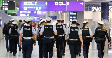 German police officers walk in an airport terminal, Frankfurt, March 23, 2016. (AP Photo)
