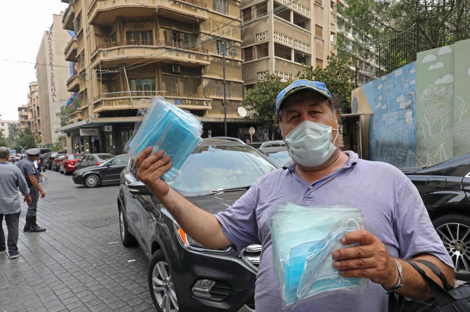 A man sells protective face masks ahead of lockdown measures after a spike in new cases threatened to overwhelm the crisis-hit Lebanon's health care system, Beirut, Lebanon, July 29, 2020. (AFP Photo)