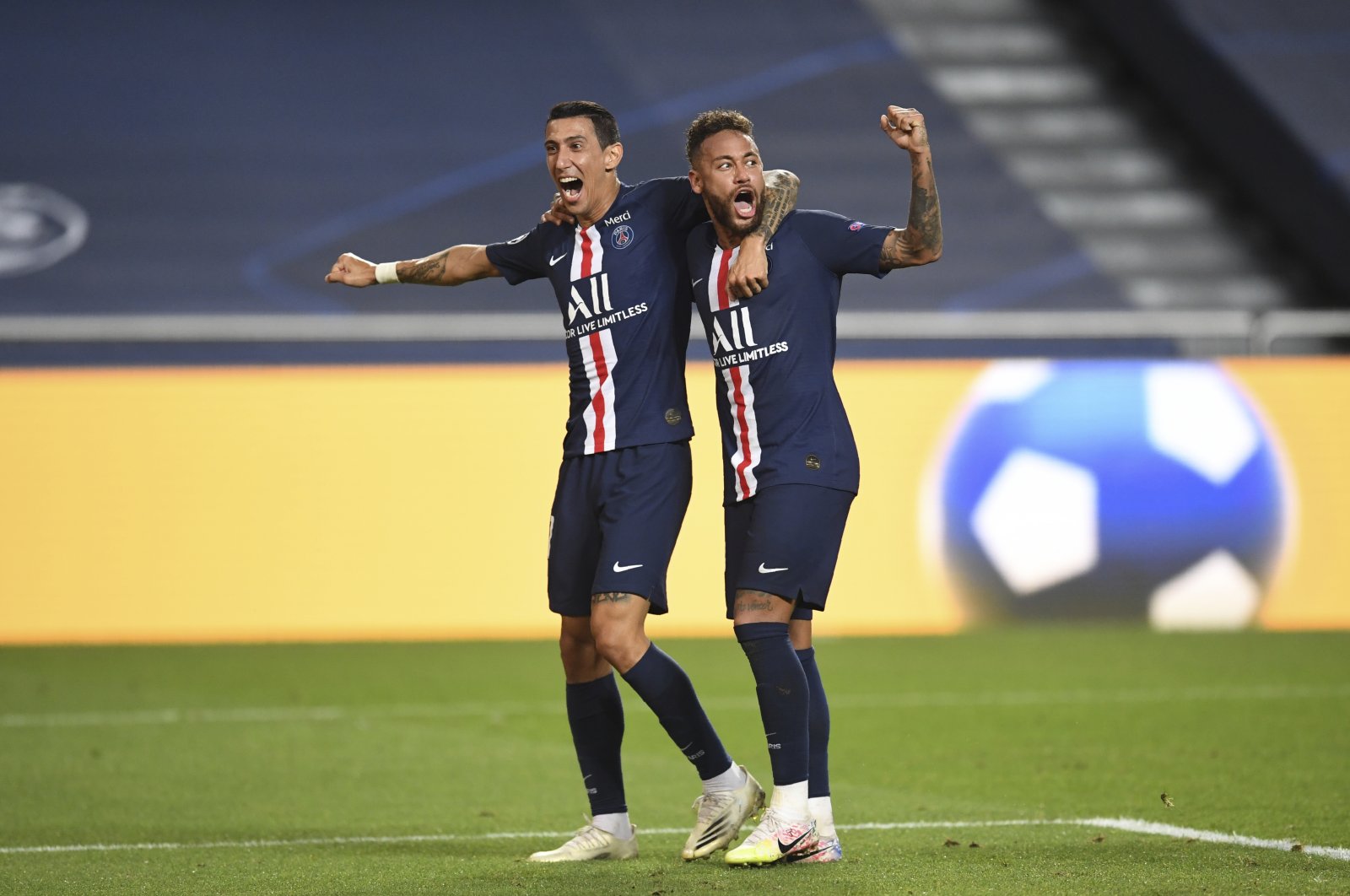 PSG's Angel Di Maria, left, celebrates after scoring his side's second goal with PSG's Neymar during the Champions League semifinal football match between RB Leipzig and Paris Saint-Germain at the Luz stadium in Lisbon, Portugal, Tuesday, Aug. 18, 2020. (Pool Photo via AP)