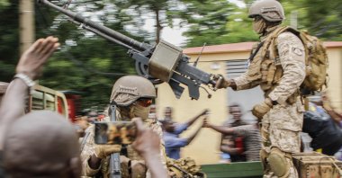 Malian soldiers parade as they arrive by military vehicle at Independence Square in Bamako, Mali, after rebel troops seized Malian President Ibrahim Boubacar Keita and Prime Minister Boubou Cisse in a dramatic escalation of a monthslong crisis, Aug. 18, 2020. (AFP Photo)