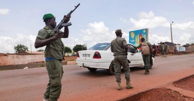 Malian soldiers check a vehicle in the garrison town of Kati, Aug. 18, 2020. (AP Photo)
