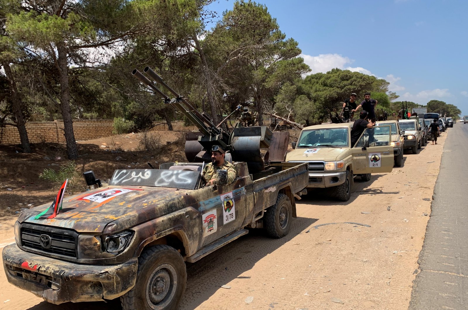 Troops loyal to Libya's internationally recognized government are seen in military vehicles as they prepare for a mission to Sirte, in Tripoli, Libya. July 6, 2020. (Reuters Photo)