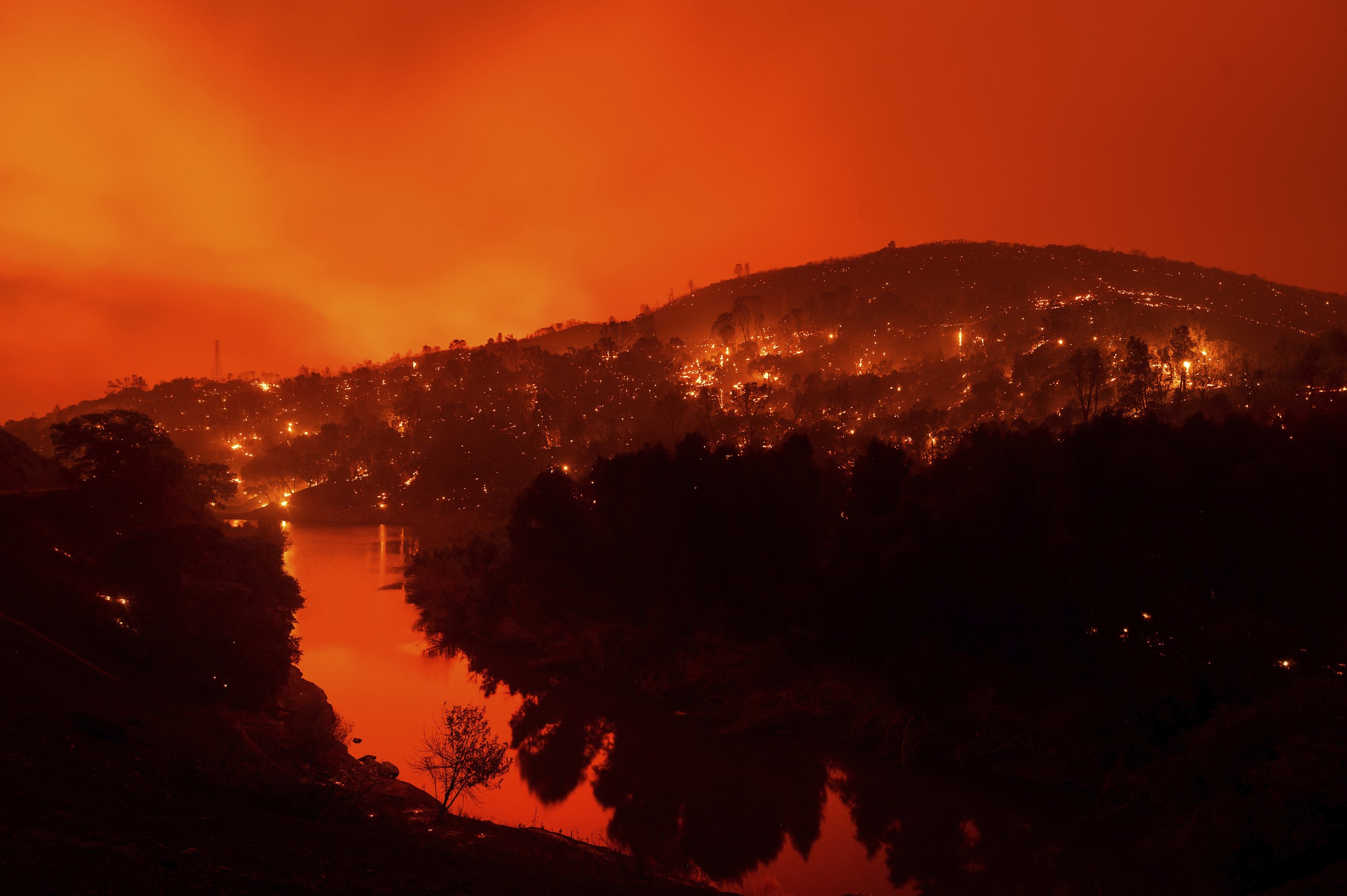 Lightning-sparked fires rage across California, tens of thousands flee ...