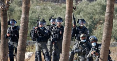 Israeli security forces gather as Palestinians protest in the village of Turmus Aya near the occupied West Bank city of Ramallah, Palestine, Aug. 19, 2020. (AFP Photo)