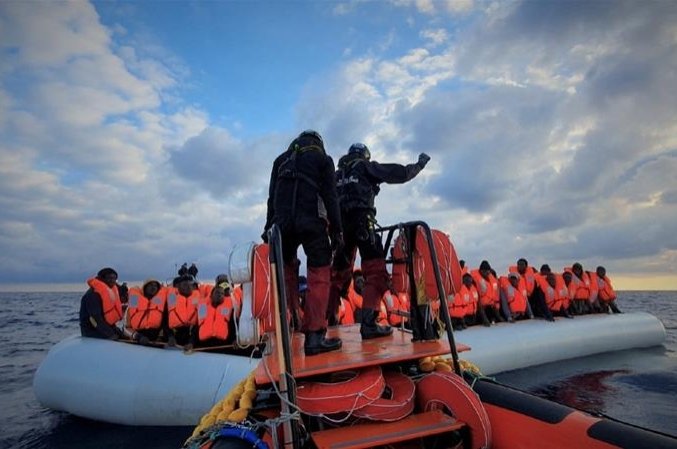 Migrants wearing life jackets on a rubber dinghy are pictured during a rescue operation, off the coast of Libya. (Reuters Photo)