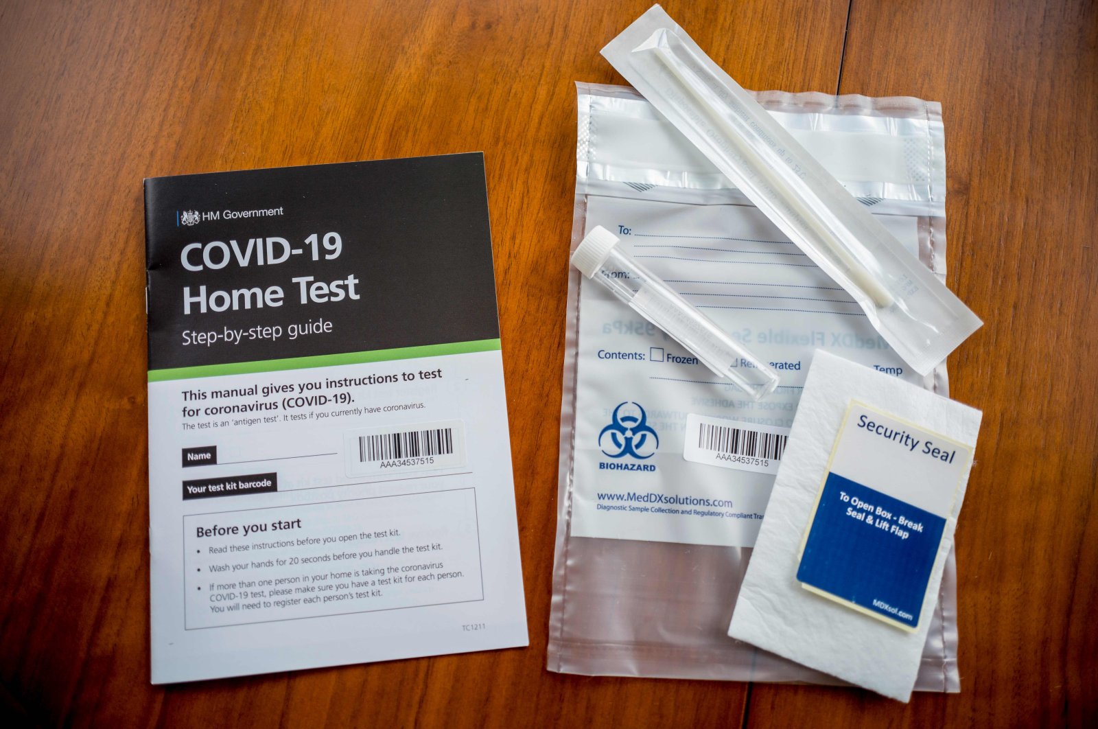 A photograph taken in London on August 18, 2020 shows the contents of a UK Government COVID-19 antigen home test kit. (AFP Photo)