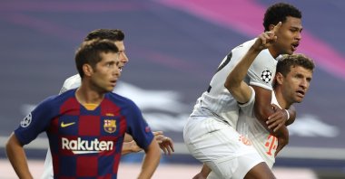 Bayern Munich's Thomas Muller (R) celebrates with Serge Gnabry after scoring a goal during a UEFA Champions League match against Barcelona in Lisbon, Portugal, Aug. 14, 2020. (AP Photo)