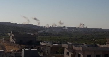 The Syrian regime forces hit Fattira village in the country's northwestern Idlib region, Aug. 20, 2020. (İHA Photo)