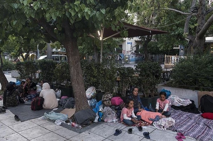 An Afghan family spends the night outside after being expelled from Greece's Moria camp and having nowhere else to go, Athens, Greece, June 15, 2020. (AA Photo)