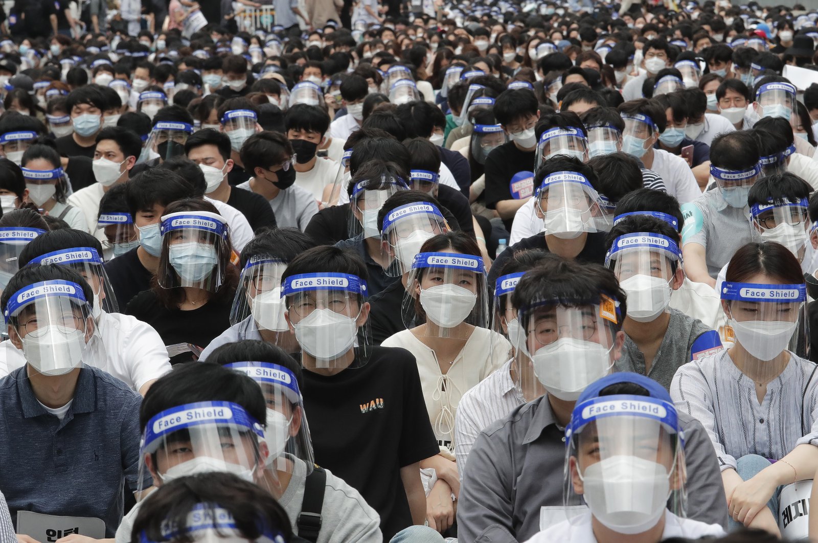 Interns and resident doctors stage a rally against the government medical policy in Seoul, South Korea, Aug. 7, 2020. (AP Photo)