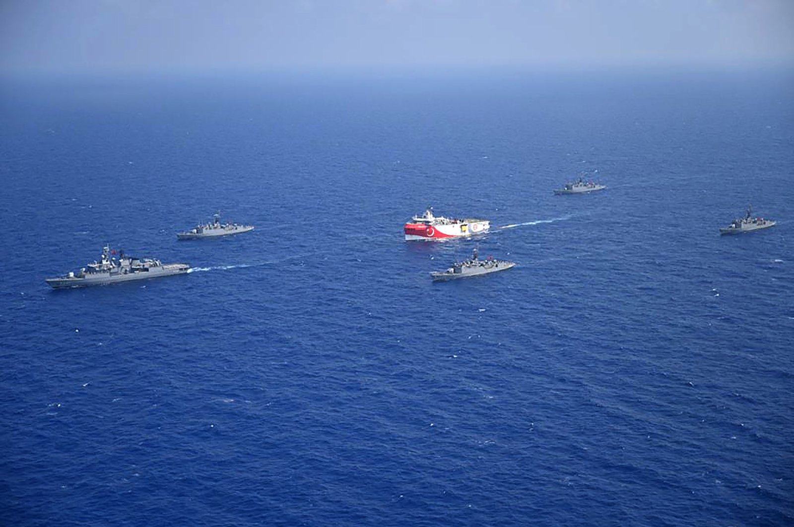 Turkish seismic research vessel Oruç Reis (C) is escorted by Turkish naval ships in the Mediterranean Sea, off Turkey's southern Antalya province, Aug. 12, 2020. (Turkish Defense Ministry handout via AFP Photo)