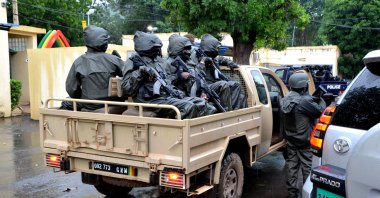The escorts of Col. Assimi Goita wait in the back of a pickup, Bamako, Mali, Aug. 22, 2020. (REUTERS Photo)
