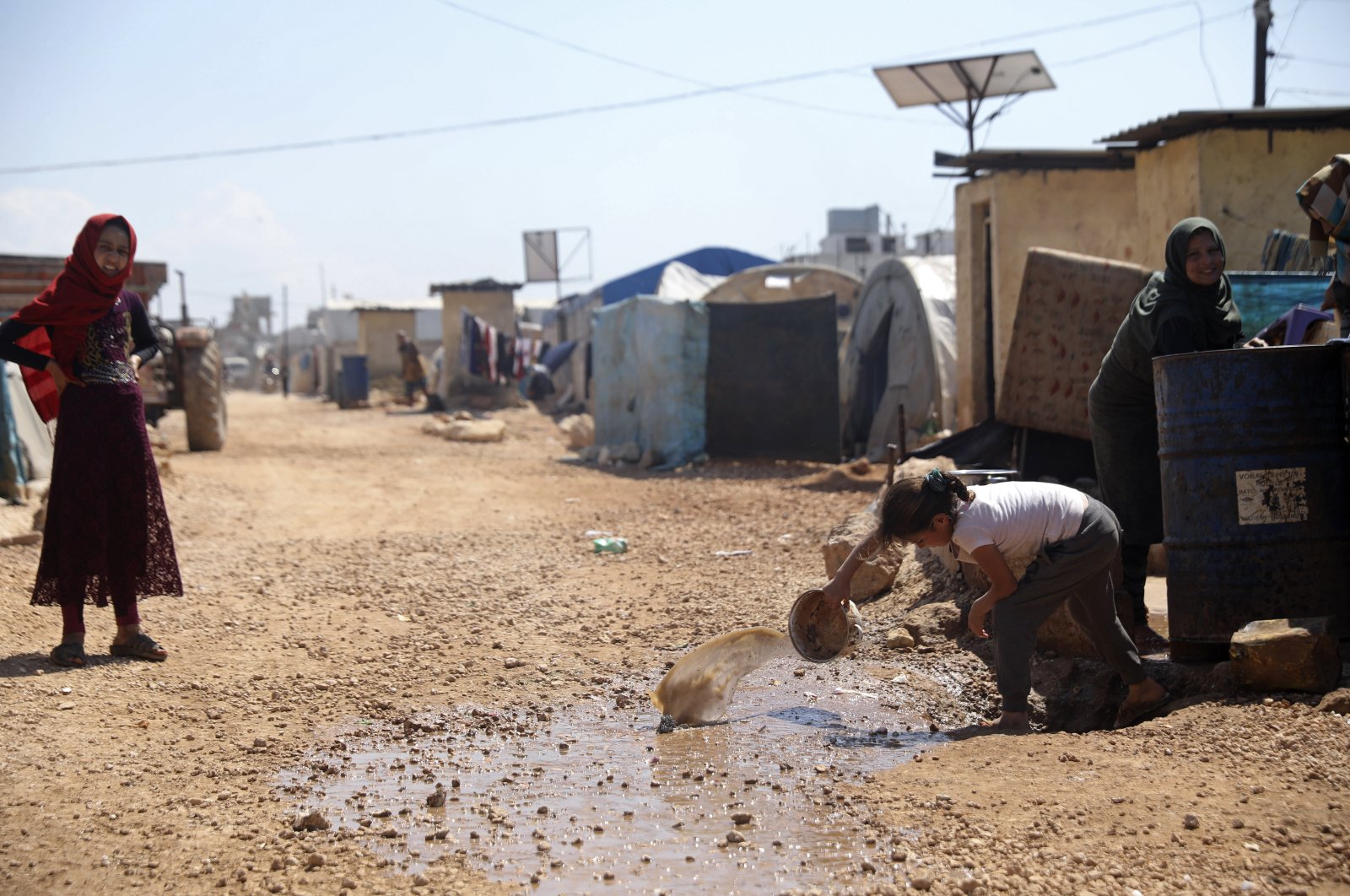 This file photo shows a large refugee camp on the Syrian side of the border with Turkey, near the town of Atma, in Idlib province, Syria, April 19, 2020. (AP Photo)