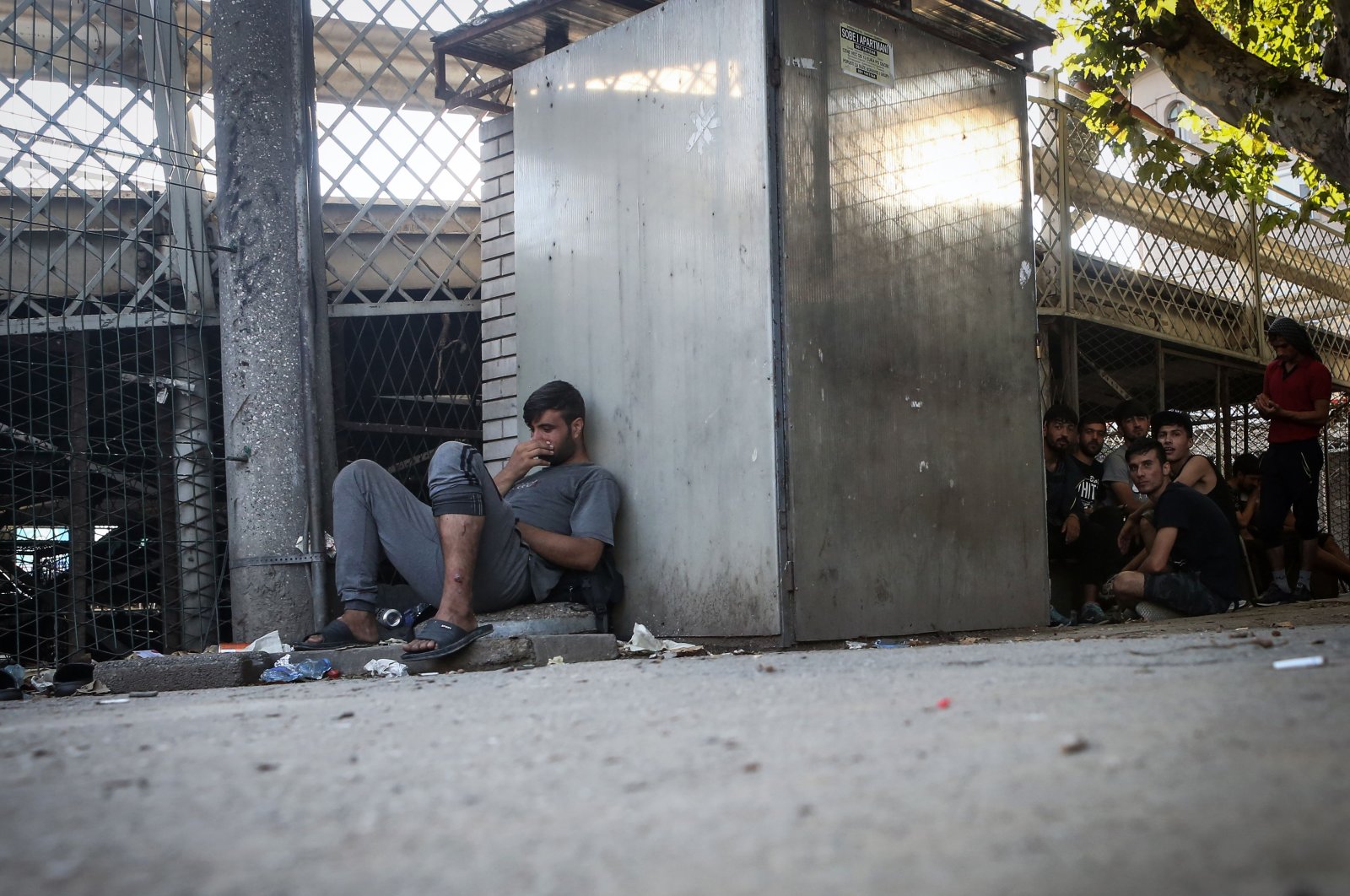 A group of migrants rest at a park in downtown Belgrade, Aug. 19, 2020. (AFP)