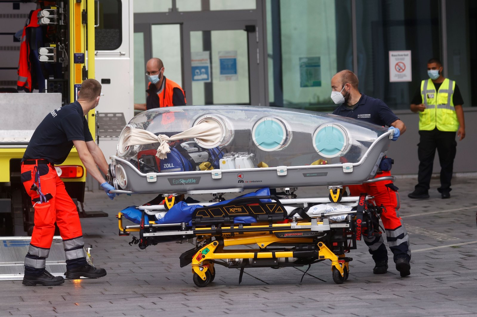 German army emergency personnel load into their ambulance the stretcher that was used to transport Russian opposition figure Alexei Navalny at Berlin's Charite hospital, where Navalny is being following a suspected poisoning, Germany, Aug. 22, 2020. (AFP Photo)