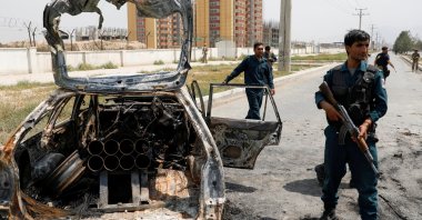 Afghan police officers inspect a vehicle from which insurgents fired rockets, in Kabul, Afghanistan, Aug. 18, 2020. Reuters Photo)