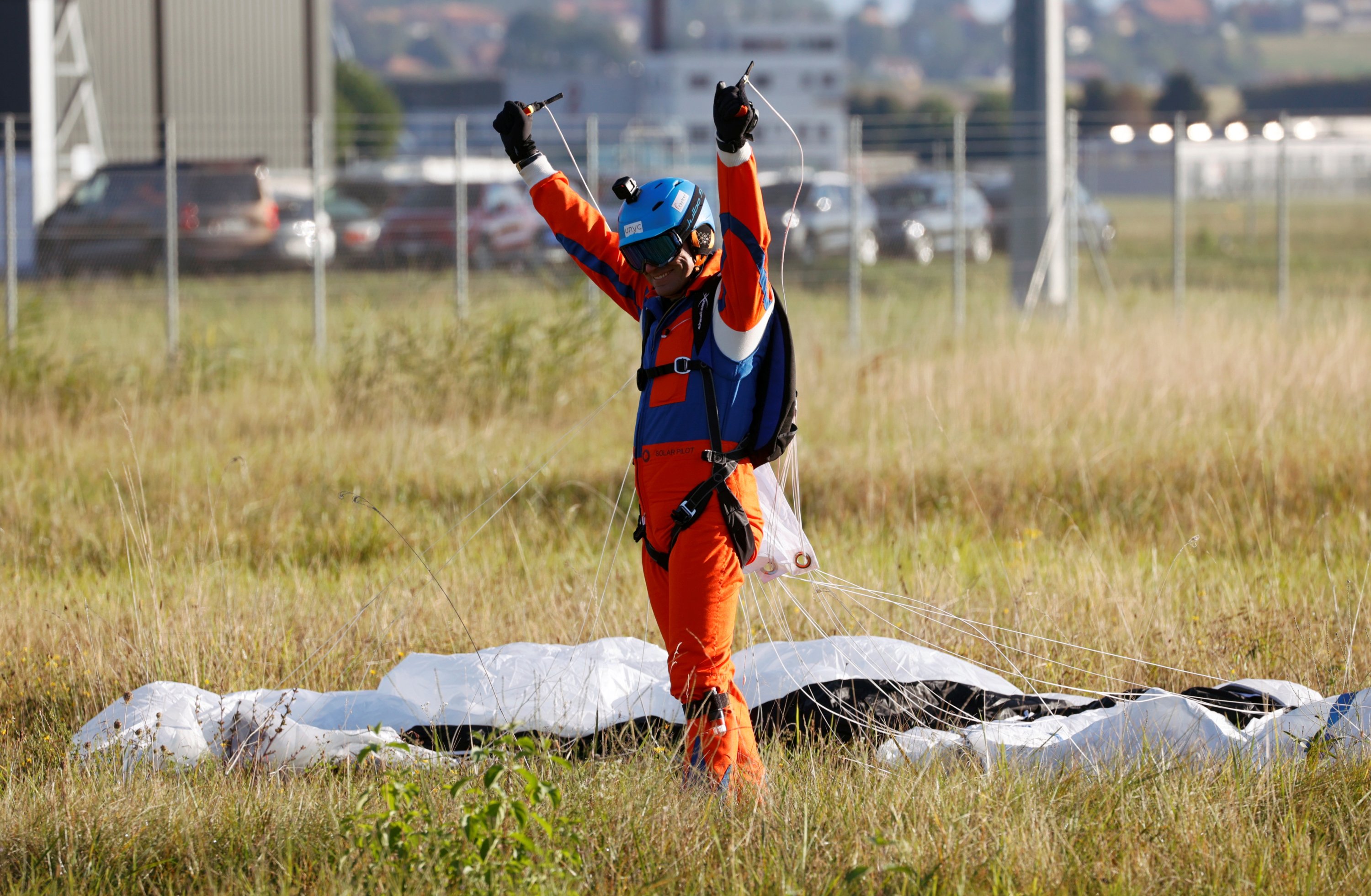 Project instigator Raphael Domjan reacts upon landing after he jumped with a parachute from the SolarStratos aircraft, a solar-powered two-seater aircraft, in Payerne, Switzerland August 25, 2020. REUTERS/Denis Balibouse