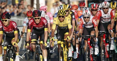 Colombia's Egan Bernal, wearing the overall leader's yellow jersey (C), races on the Champs Elysees during the Tour de France in Paris, France, July 28, 2019. (AP Photo)