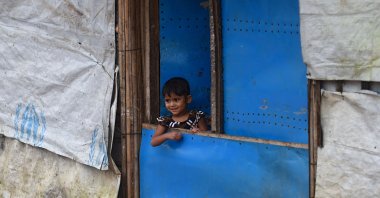 A child stands at the entrance of a house in Kutupalong refugee camp near Ukhia, Bangladesh, Aug. 25, 2020. (AFP Photo)