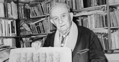 In this undated file photo, Ibrahim Hakkı Konyalı is seen with a document in a library.