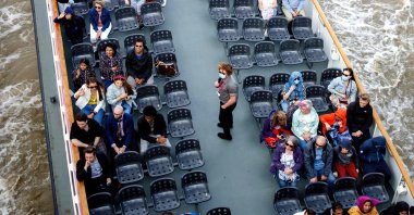 People enjoy a cruise tour on River Thames in central London, U.K., Aug. 24, 2020. (AFP Photo)