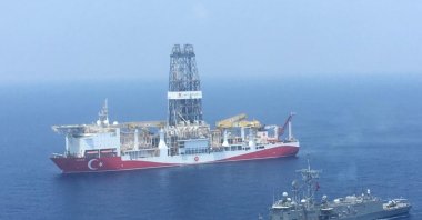 In this July 9, 2019, file photo, a Turkish navy warship escorts drillship "Fatih" as it travels toward the Eastern Mediterranean near Cyprus. (AFP Photo)
