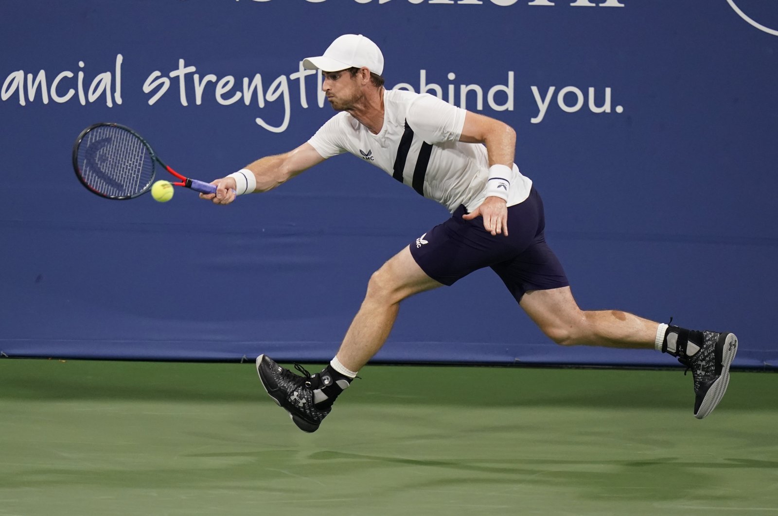 Andy Murray stretches for a ball from Milos Raonic during the third round at the Western & Southern Open tennis tournament in New York, U.S., Aug. 25, 2020. (AP Photo)